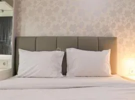 Minimalist and Warm 1BR Signature Park Grande Apartment By Travelio