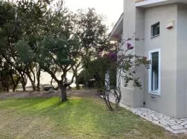 Secluded seaside villa w garden sea-sunset view