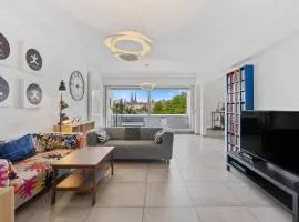 Central Lux 2BR Apt with City Views & Balcony