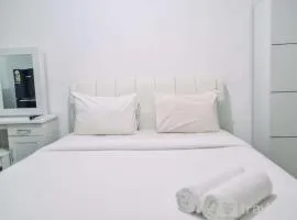 Minimalist Studio Room at Urbantown Serpong Apartment By Travelio