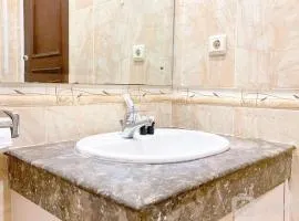 Homey and Comfort Stay 2BR Bellezza Apartment By Travelio