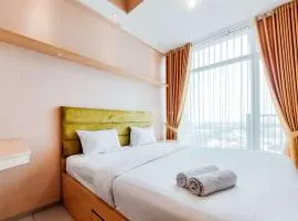 Homey and Modern Studio at Tree Park City Cikokol Apartment By Travelio