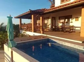 3Suítes, piscina e vista do mar em condomínio pé na areia - pátio compartilhado