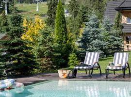 Domki w Białce WOODHOUSE- Twój górski azyl przy stoku – hotel w mieście Białka Tatrzanska