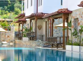 Okapi Suites, hotel v destinaci Ula