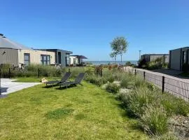 Enkhuizer Strand Chalet Windrose mit Zaun Haus Nr 225