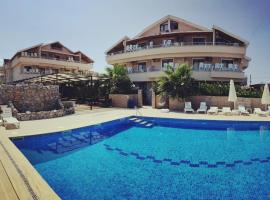 Altinkum tatil konakları, hotel v destinaci Yiğitler