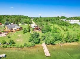 Riverfront Cheboygan Home with Dock about 4 Mi to Town!