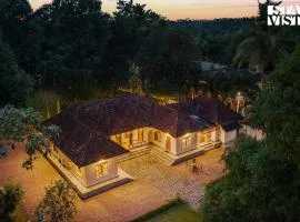 CVM House with Lawn at Thiruvalla by StayVista