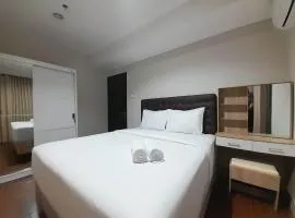 Elegant and Spacious 1BR at Patraland Amarta Apartment By Travelio