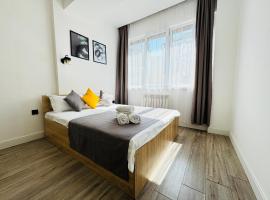 417I1 Gray and Yellow apartment Sholpan city, hotel di Almaty