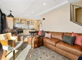 Marvelous Downtown Apartment Moments from Main Beach with Heated Pool, Gym and Parking