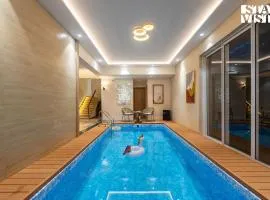 Mocha House with Indoor Pool, BBQ & Bonfire at Lonavala by StayVista