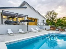 Villa Bellavu for 8 people with playground & sea view in Rakalj