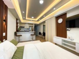 Cozy Studio Unit in Abreeza Place T1 with Paid Parking, отель в Давао