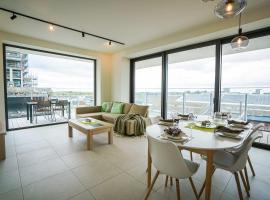 Huswell - Beautiful apartment with communal pool and gym，位于奥斯坦德的酒店