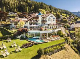 Alpenheim Charming & Spa Hotel, Hotel in St. Ulrich in Gröden