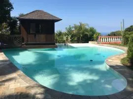 Bungalow confortable à Ruisseau avec piscine partagée