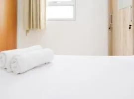 Homey 2BR at Puncak Permai Apartment By Travelio