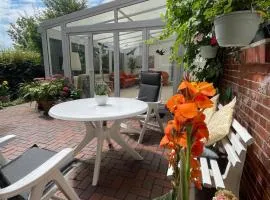 Ferienwohnung mit WINTERGARTEN in Bahnhofsnähe