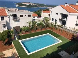 Sandy bay apartments with pool