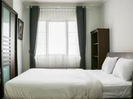 Cozy Living and Modern 2BR Puri Garden Apartment By Travelio