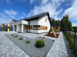 Pelna chata - dom wakacyjny Rowy nad morzem, дом у озера в аренду в Ровах