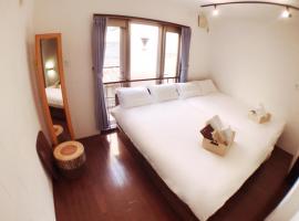 Osaka Sinsei Guest House, hotel in Osaka