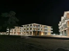 Lägenhet på stranden i Åhus med havsutsikt och närhet till Spa & utomhuspool