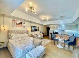 Cozy Place @ Venice Luxury Residences, hôtel à Manille