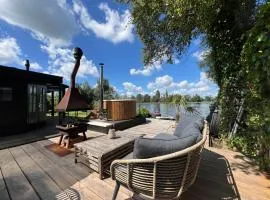 New- The Cabana- With Sauna and Hot Tub, on a lake near Amsterdam