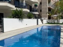 Air-conditioned Elisa Apartment with spacious sunroof lounge and swimming pool