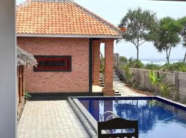 Rumah Pantai Krui, hôtel à Wainapal
