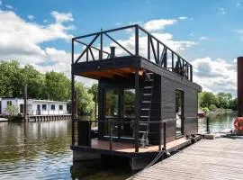 Tiny-Hausboot LIKEDEELER mit Dachterasse und Kamin