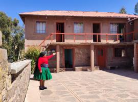 Home in Taquile - Q'uñi wasi, stanza in casa privata a Huillanopampa