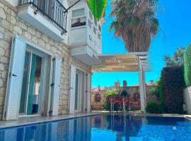 Evalacati-Villa Palma-Şömineli- Kış Düzeninde, hotel a Çeşme