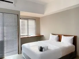 Homey and Minimalist Studio Gateway Park LRT City Jatibening Apartment By Travelio