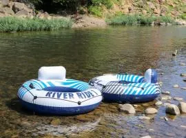 Wind down in this 2 Bed Oasis with River Access Hot Tub and Outdoor Fun Sleeps 6 Comfortably