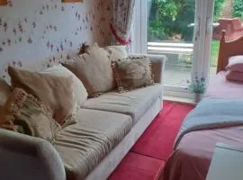 Ground floor, large room, 2 single beds, sofa, TV, wifi & patio