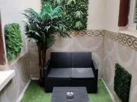 Appartement cosy avec patio en RDC
