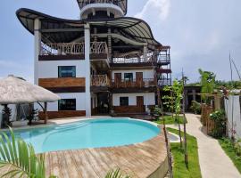 The Hat Trick Hostel، فندق مع موقف سيارات في Basdiot