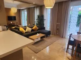 Gardenia CFC by IB Signature - Cosy 1Bedroom Apt with Wifi, 24x7 Security, Parking, Self check-in, Large terrace, Walk to Cafes and Gym