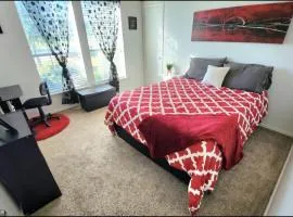 Comfortable Queen Bedroom with workspace