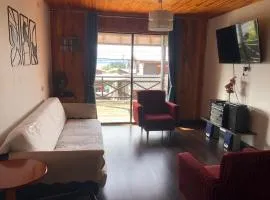 Cabaña a pasos de la costanera con estacionamiento
