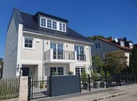 Exklusive Neubau Dachterrassenwohnung mit Wohnungslift in Vierfamilienvilla