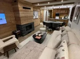 Appartement chaleureux à Megève - 80 m² avec jardin et cheminée.