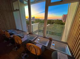 安平胡桃民宿-公園景觀泡腳池-免費停車-專屬電梯-烤肉租借, hotel na praia em Tainan