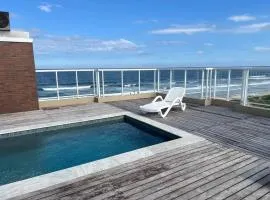 Apartamento pé na areia