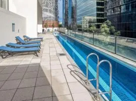 Stylish City Getaway with Pool Gym Parking