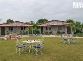 StayVista at Wildwoods Stone with Pool, Bathtub, Wi-Fi